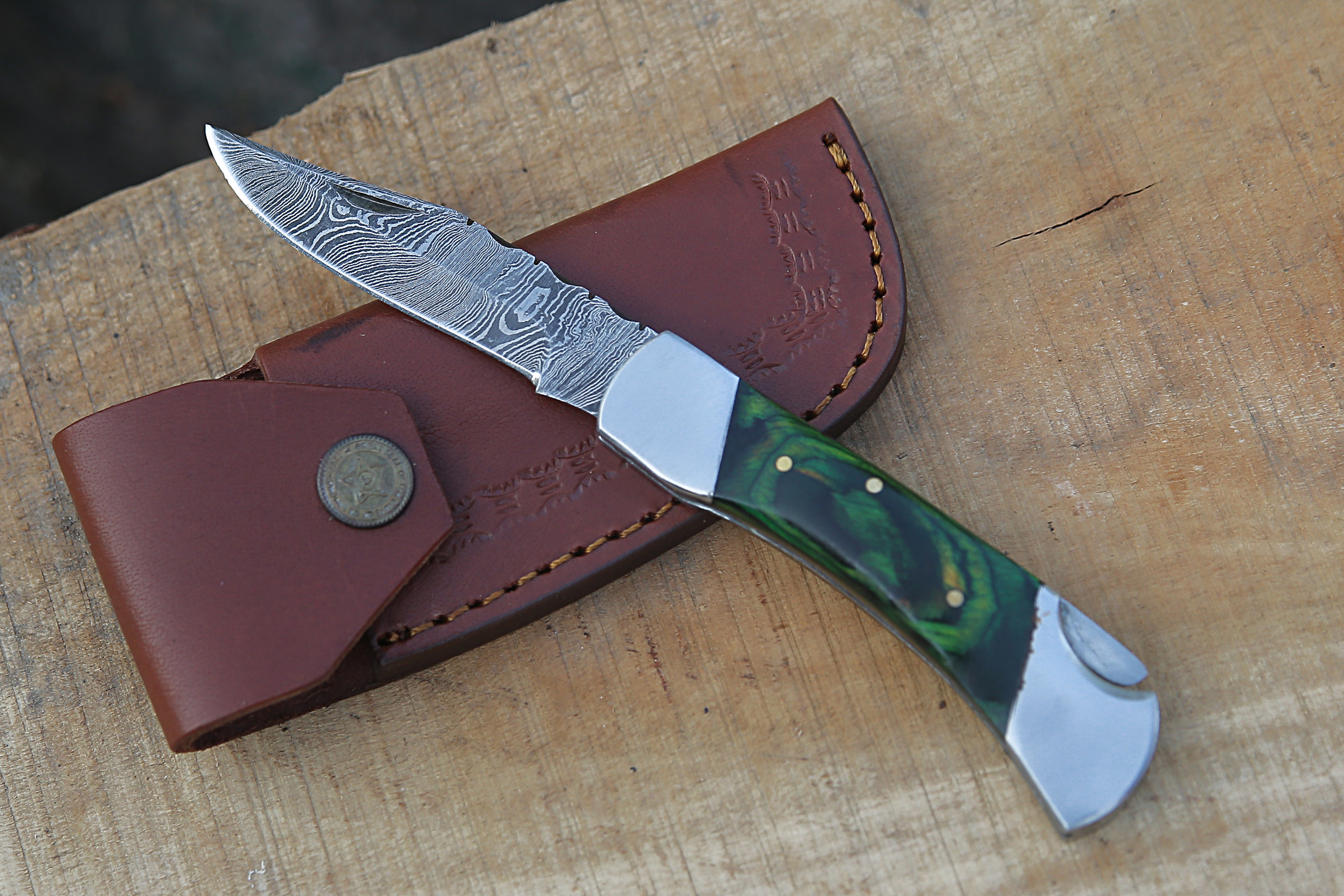 https://www.damascusknifehub.com/cdn/shop/products/DamascusFoldingKnife_9bceb045-8011-4d1e-af2a-d6c6db45e969.jpg?v=1632412634